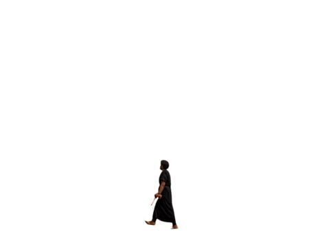 Pilgrim walking toward church on hilly landscape  