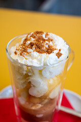 Iced coffee with whipped cream and crumble in a  glass in Waterloo, Brabant Wallon, Belgium