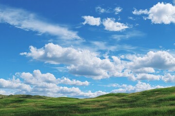 Fototapeta premium Bright blue sky over lush grassy hill landscape