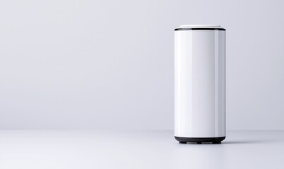 Sleek container on surface. A cylindrical container with a white body and dark accents sits on a neutral surface, creating a minimalist, clean aesthetic. Soft shadows accentuate the form