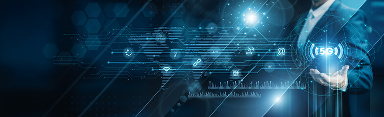 Businessman holding building of 5G technology networks, ultra-fast connectivity IoT devices, automation communication infrastructure, data transfer latency reduction, and mobile performance.