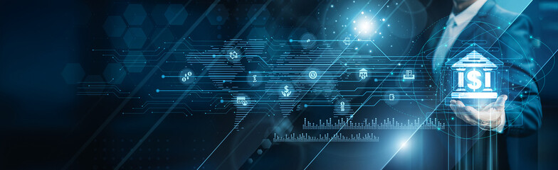 Businessman holding building of banking services, digital transactions finance risk management compliance fintech customer assets investment automation security performance.