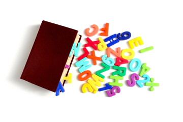 There are letters and a book on a white background.	