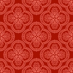 Seamless geometric pattern with ornate floral mandala design in warm pink on a red background. Perfect for textile design, wallpaper, wrapping paper, digital backgrounds, surface decoration