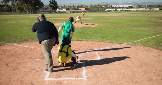 Pitcher preparing fastball, batter swinging through pitch at plate, umpire signaling strike three