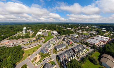 Fototapeta premium Sunny Daytime Drone Images of Wake Forest, North Carolina Featuring the Downtown Historic District, Businesses, and Residential Developments: Tourism, Real Estate, Travel