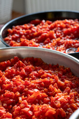 Grated tomatoes being prepared for winter storage in jars
