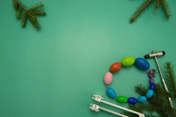 Christmas Medical Instruments with Christmas Tree on Green Background. New Year's photo of a...