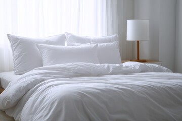 Obraz premium Pristine White Bedroom Setting. Cozy Bed with Sleek Bedclothes and Clean Duvet Styling