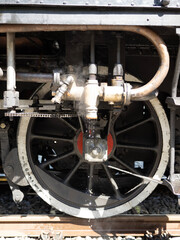 Steam locomotive wheel and piston with water and vapor