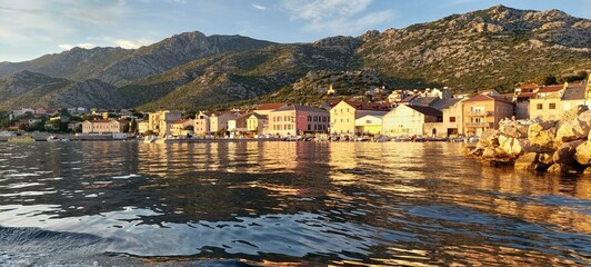 coastal area with buildings at sunset