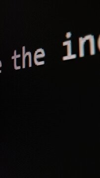 Closeup macro shot movement of coding script moving across LED screen with real-time AI-generated typing, showcasing advanced AI learning in optimization, debug and coding for software development.