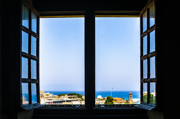 View at the Rhodes town and aegan sea photographed through window, Greece