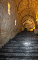 The interior grand staircase of the Palace of the Grand Master of the Knights of Rhodes with huge vaulted ceilings, Greece