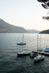 Sailing boat at the dock overlooking Lake Como Italy