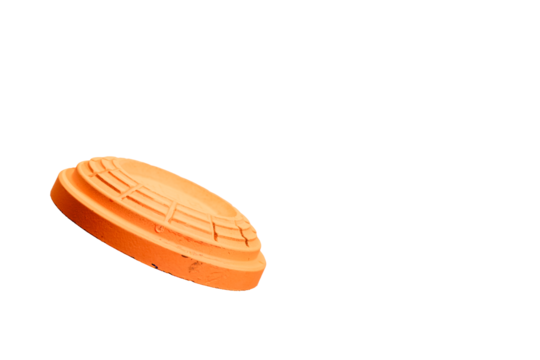 clay orange target flying in air with transparent background, used for sporting clays, skeet and trap