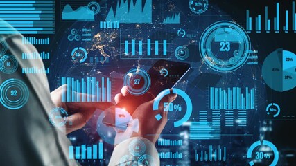 A businessman engages with a smartphone in a modern office, surrounded by digital graphs and charts that represent financial data and analytics in a futuristic setting. Xenic - Powered by Adobe