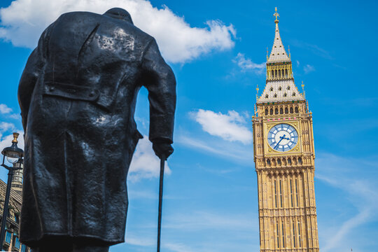 View of Big Ben clock tower behind Winston Churchill's statue in London, Uk