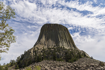 Devils Tower National Monument blue sky white clouds