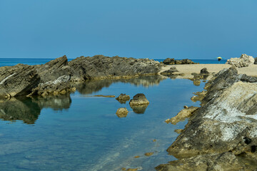 Scenic coastal landscape with rocky shoreline.