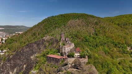 Ancient walls remain. Stone towers rise. Forest surrounds fortress. Time feels eternal.