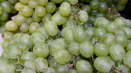 Fresh green grapes in close-up — a natural fruit backdrop for culinary design, healthy food...