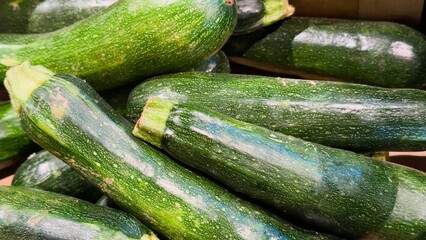 Fresh green zucchini with natural texture and shine — a versatile vegetable backdrop for culinary design, farm brands, packaging, food blogs, and healthy eating content.