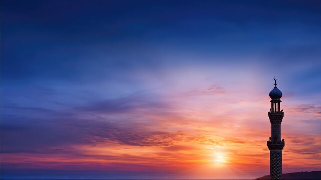 A tall, ornate Islamic minaret stands against a vibrant sunset sky with hues of orange, pink, and deep blue, evoking a sense of peace and spiritual reflection.