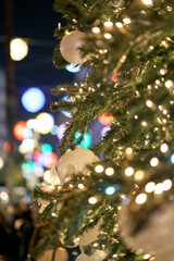 Decorated Christmas Tree Branch with Colorful Bokeh