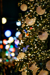 Festive Christmas tree with glowing lights and ornaments.