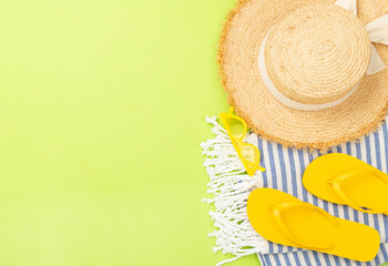 Blue beach accessories on color background, top view. Copy space for text