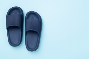 Blue sandals on color background,top view