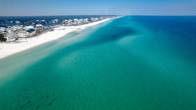 Aerial View of Florida’s Scenic 30A Coastline Near Eastern Lake with Turquoise Waters and White Sand Beaches