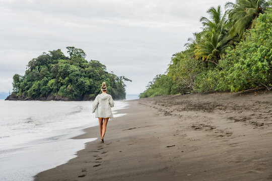 Tourist walking on a tropical beach in colombia