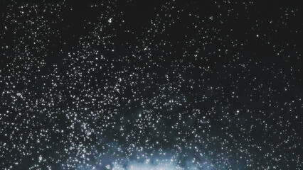 Dust particles on black background. Abstract dust particles with white light bokeh, snow glare and flare sparkles