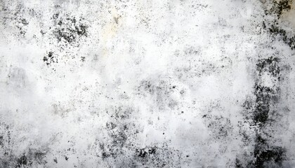 An abstract full-frame image captures the distressed texture of a white wall, heavily marked with dark grunge stains, creating a visually compelling pattern.