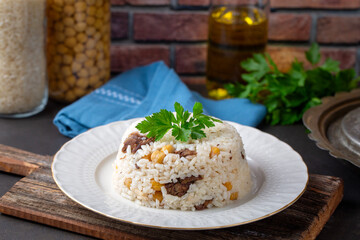 Traditional Turkish food; Roasted meat on rice (Turkish name; pilav üstü kavurma, kurban kavurma, nohutlu etli pilav)
