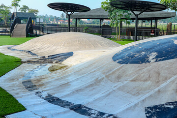 Playground with White Bouncy Surface and Green Artificial Turf