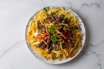 Turkish food; Cokertme Kebab - Beef meat kebab with yoghurt and french fries