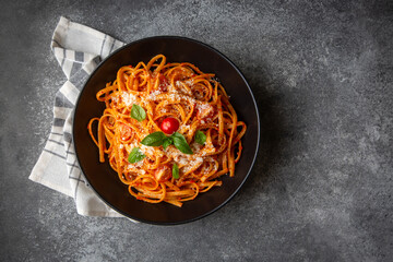Flat spaghetti pasta with delicious tomato sauce and parmesan cheese.