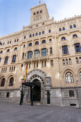 Majestic Architectural Marvel: A grand, imposing building with intricate architectural details, standing proudly against a bright, clear sky, evokes a sense of history and grandeur.
