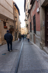 Charming Street Scene: A snapshot capturing the allure of an old European street, with its stone pathways and a blend of classical and modern architecture.