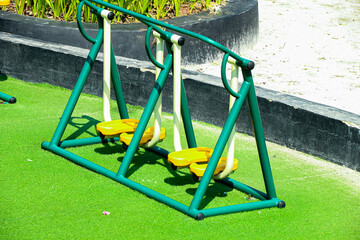 Green Exercise Equipment on Green Turf Outdoors Park Setting