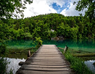 Naklejka premium Tranquil lake vista with wooden dock