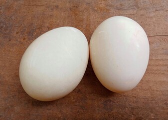 Duck eggs on a wooden table