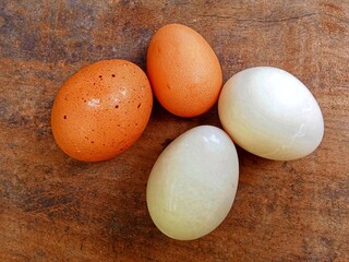 Chicken egg and duck eggs on the table 