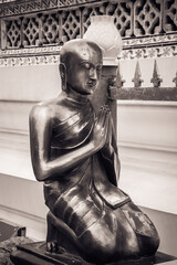 Gold statue at Wat Arun is one of a famous Buddhist temple in the Bangkok, Thailand