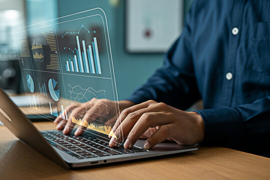 Analyzing business data on laptop with financial charts and graphs for strategic decision making process
