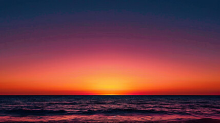 Fototapeta premium Breathtaking sunset over ocean creates serene atmosphere, with vibrant hues of orange, pink, and purple blending seamlessly into horizon. calm waves reflect stunning colors, inviting tranquility