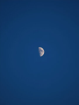 decrescent phase of the moon, decrescent moon in the sky moving away.
